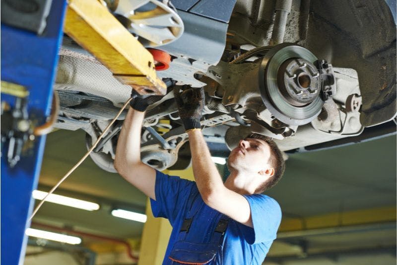 Man working on car at the auto repair shop