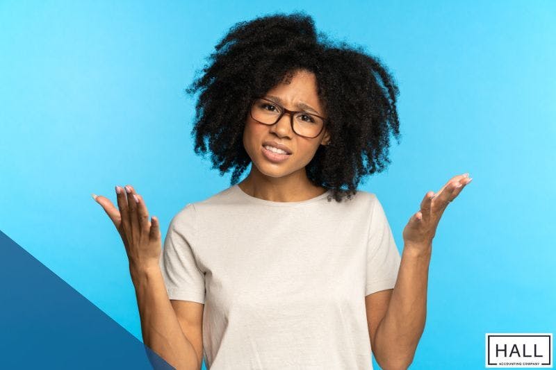 Confused individual, symbolising frustration over common tax mistakes in Texas, like missed deadlines and incorrect filings.