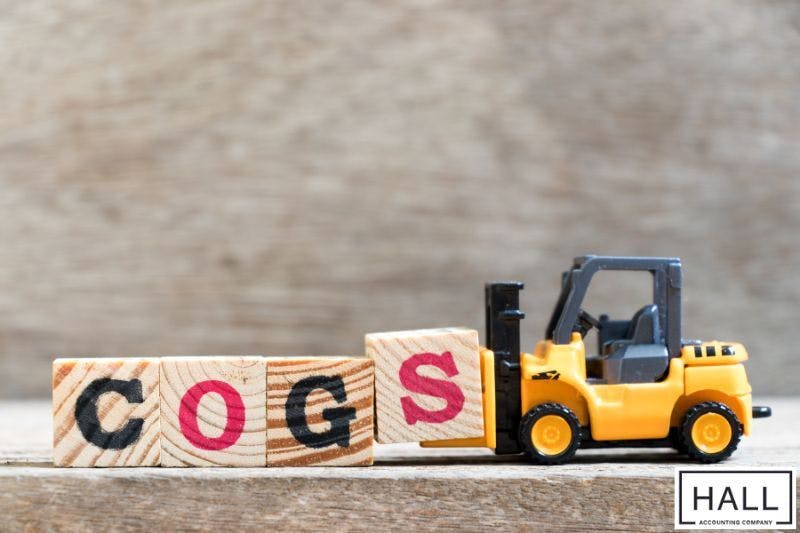 Toy forklift carrying blocks labeled