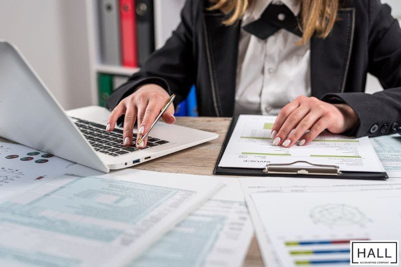 Accountant reviewing financial documents, illustrating how to find accountant for small business success