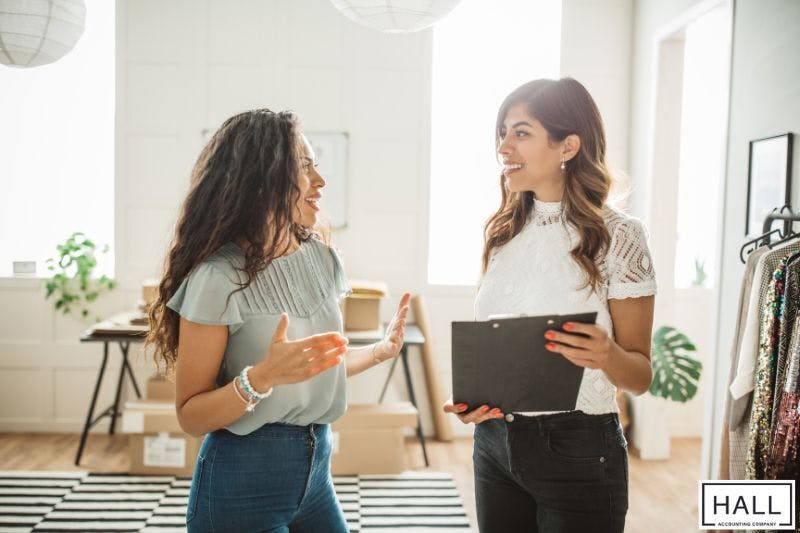 Small business owner consulting with accountant