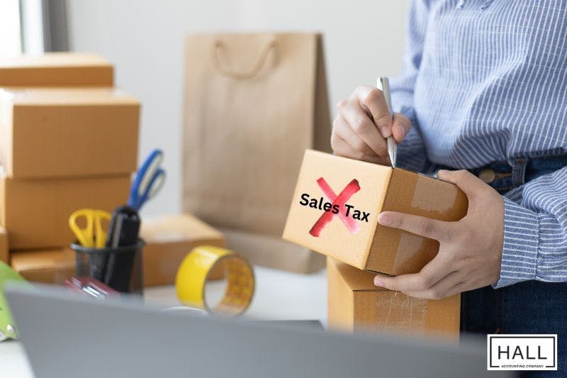 Image illustrating sales tax exemption by showing someone crossing out