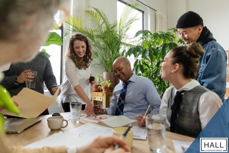 A group of small business owners discusses strategies, including tax loopholes for small business, to optimise their financial success.