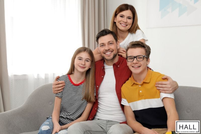 A happy family at home, representing what are dependent exemptions when it comes to taxes